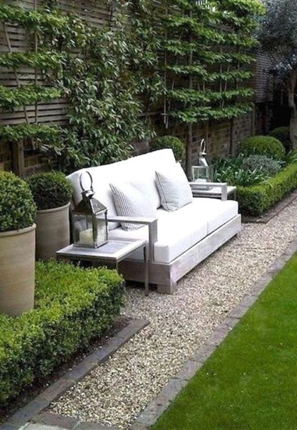 Outdoor seating with light fixtures set on side tables
