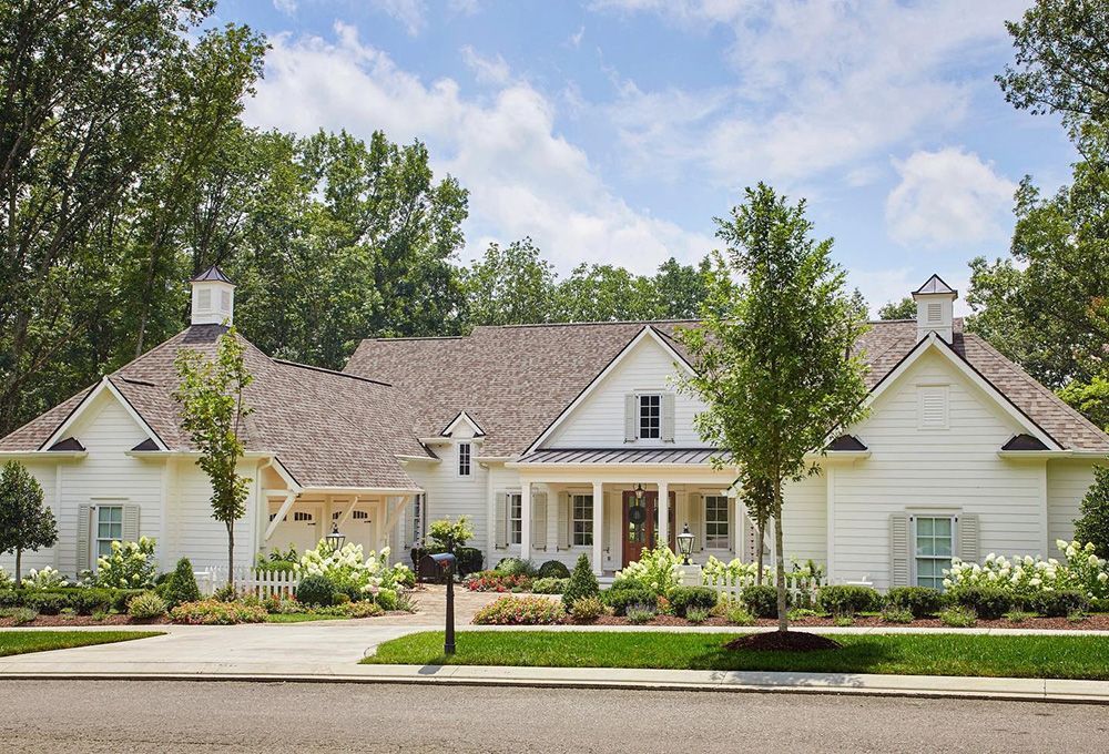 White single-story cottage with no exterior lighting