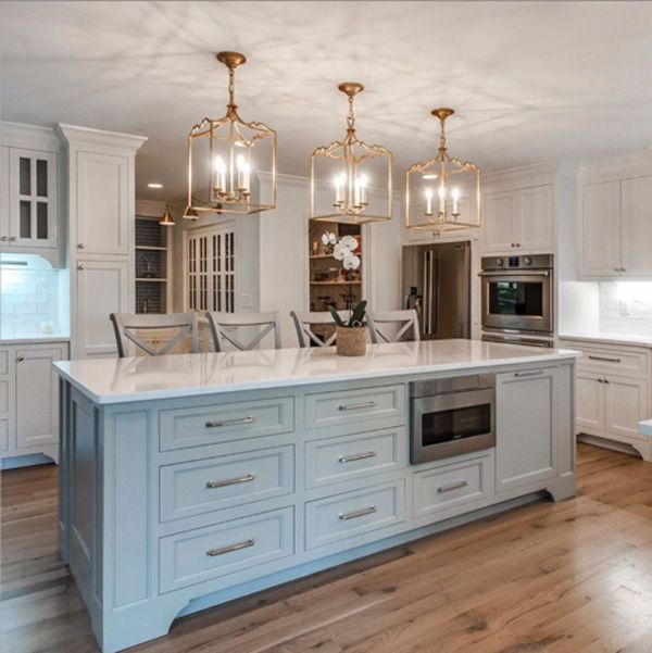 Pendant kitchen lighting - three gold pendants evenly spaced