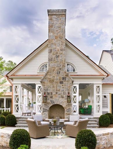 Outdoor patio with seating and fireplace