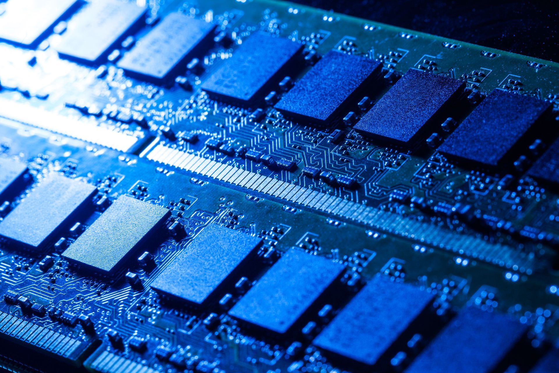 A close up of a computer motherboard with a lot of blue squares on it.