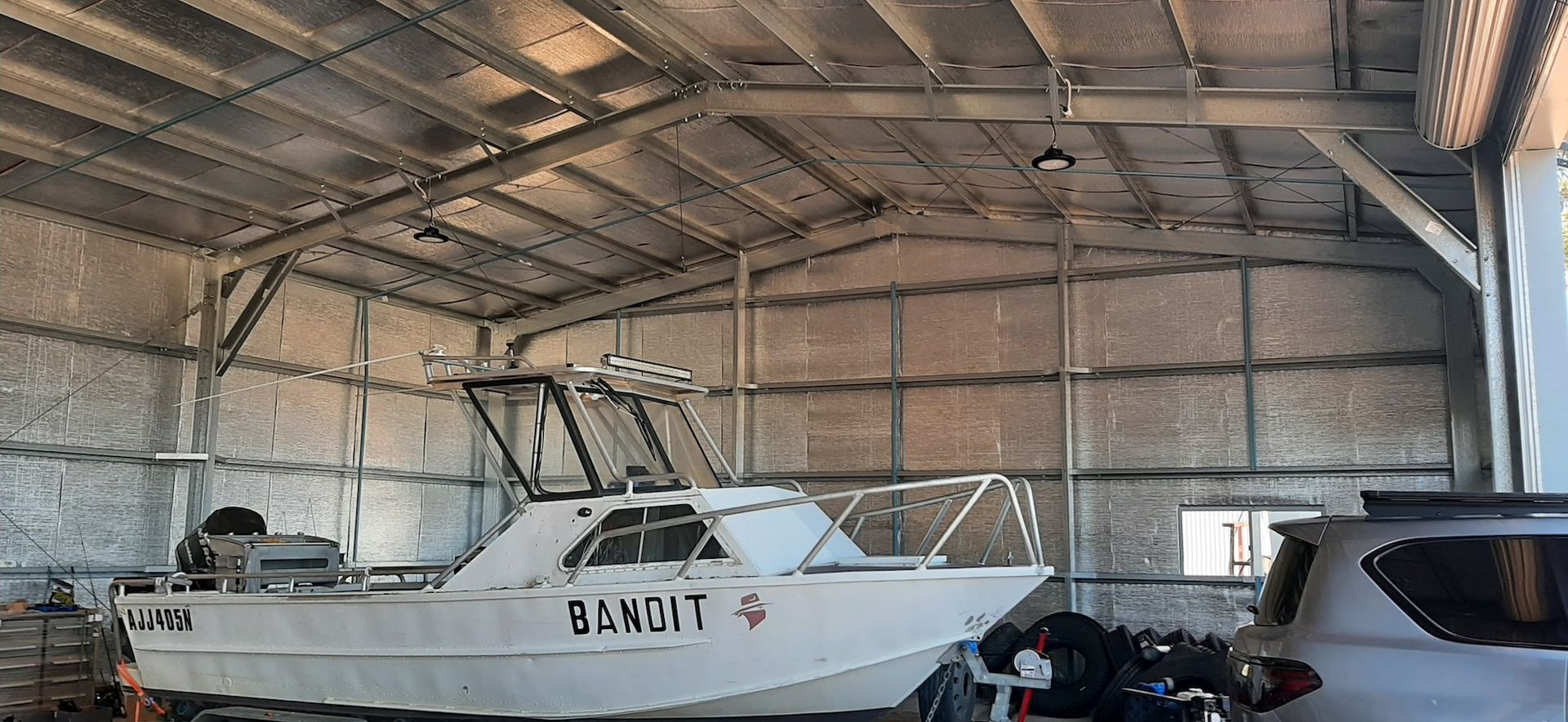 Boat Being Stored In Double Garage— Shed Kits in Lismore, NSW