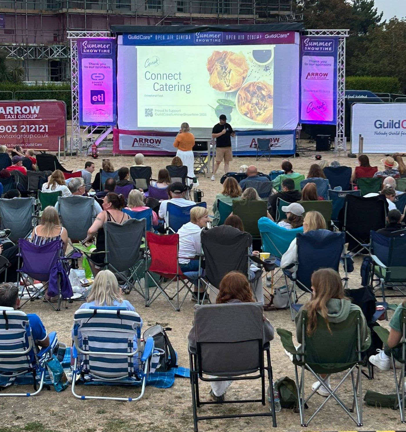 Connect Catering Gold Sponsor advert displayed at GuildCare Summer Showtime 2026 open-air cinema in