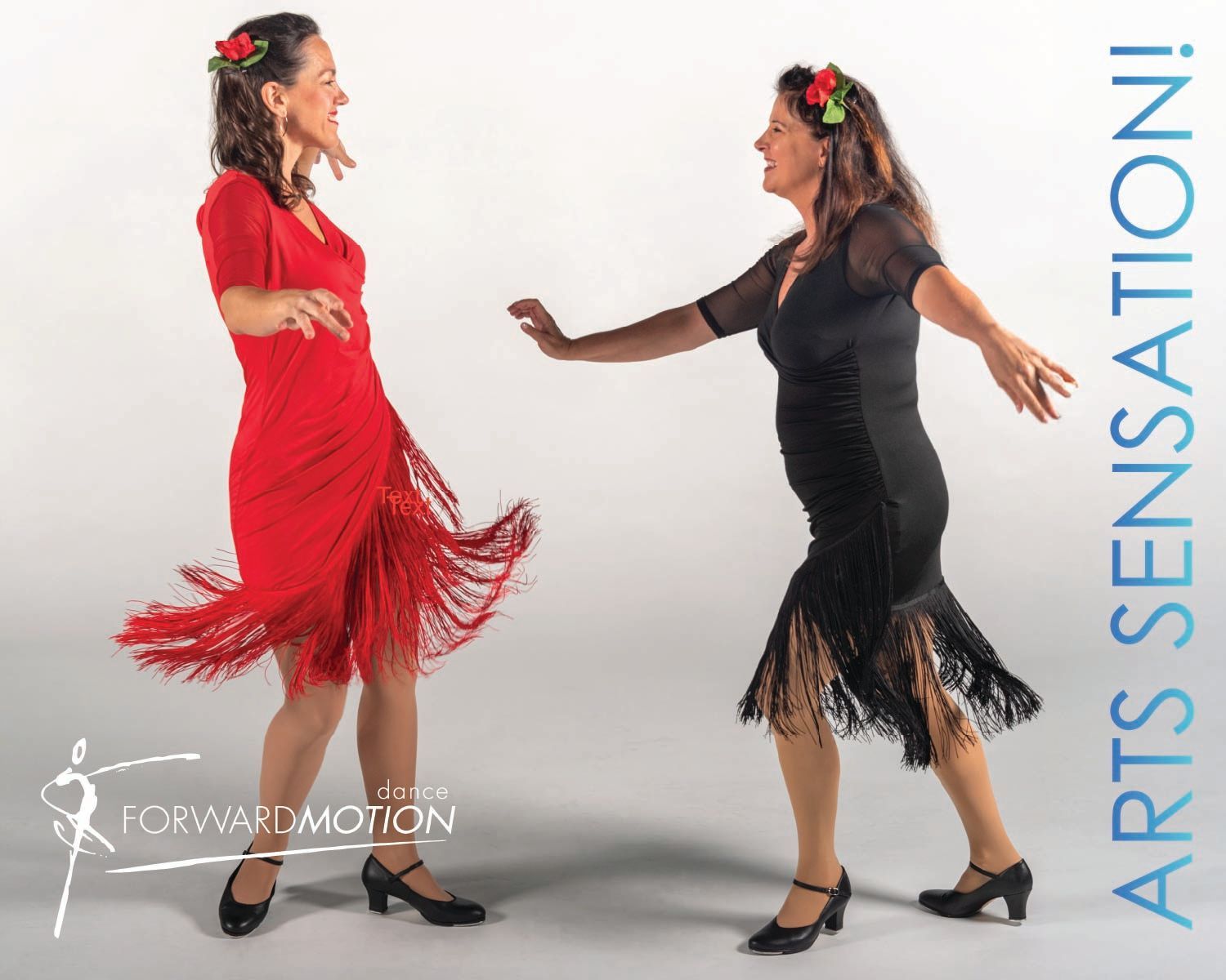 Two women in red and black dance dresses posing in studio, with “Arts Sensation” text