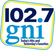 102.7 gni logo with blue and yellow border and tagline “Today’s Hits and Yesterday’s Favorites”