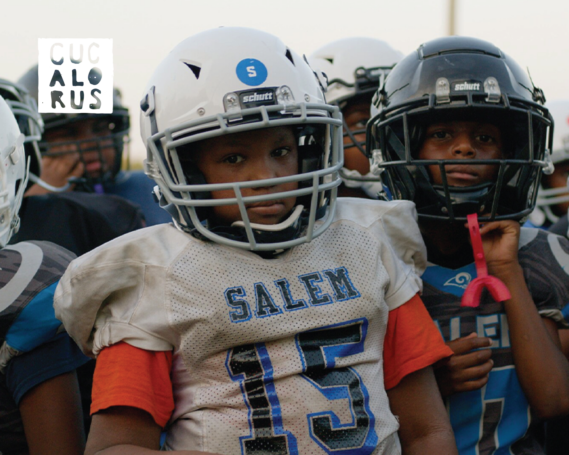 Youth football players in helmets and white jerseys lined up, one centered in a Salem jersey with number 13.