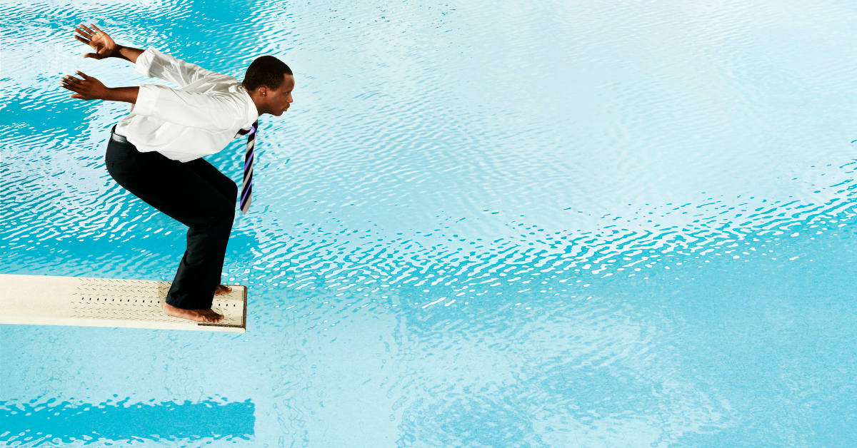 Lawyer leaping off diving board into a pool