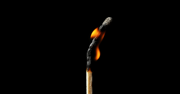 Close of up a lit match burning down