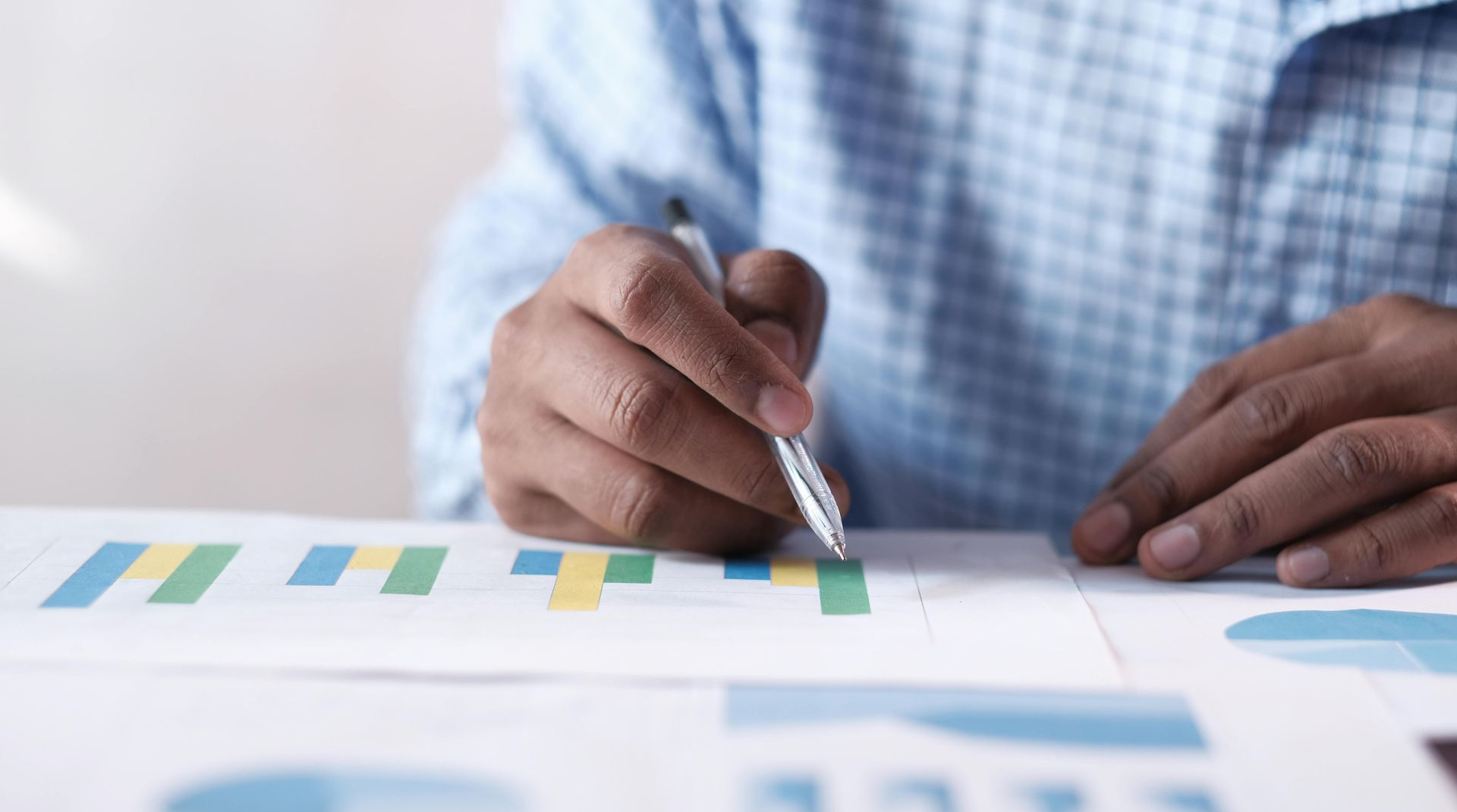 Business man reading statistics on a piece of paper