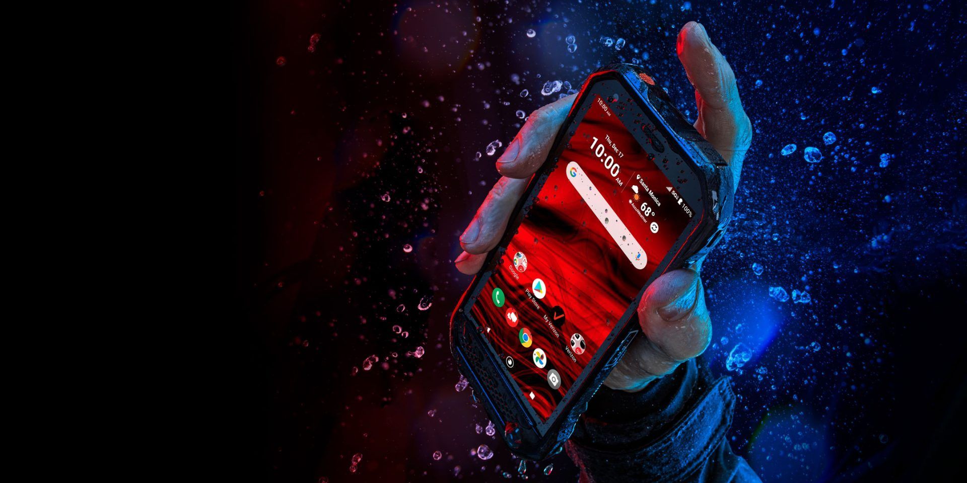 A person is holding a cell phone in their hand in the water.