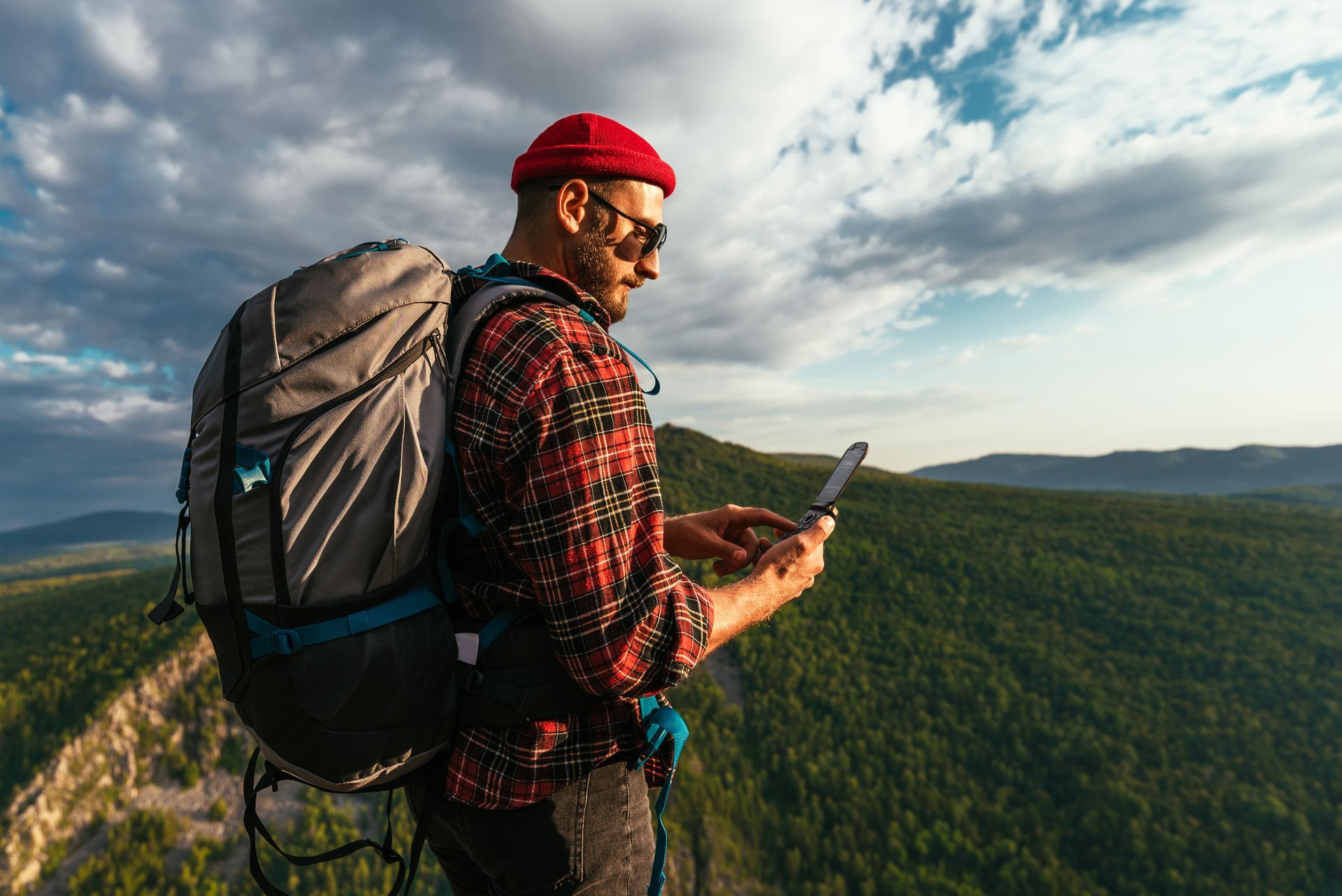 A person is holding a cell phone with the word applications on it