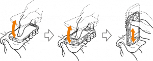 A drawing of a person holding a cell phone in their hand.
