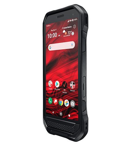 A black cell phone with a red screen is sitting on a white surface.