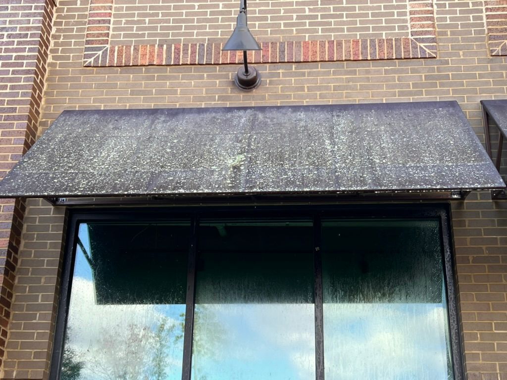 Wooden window shutters, horizontal slats, weathered appearance.