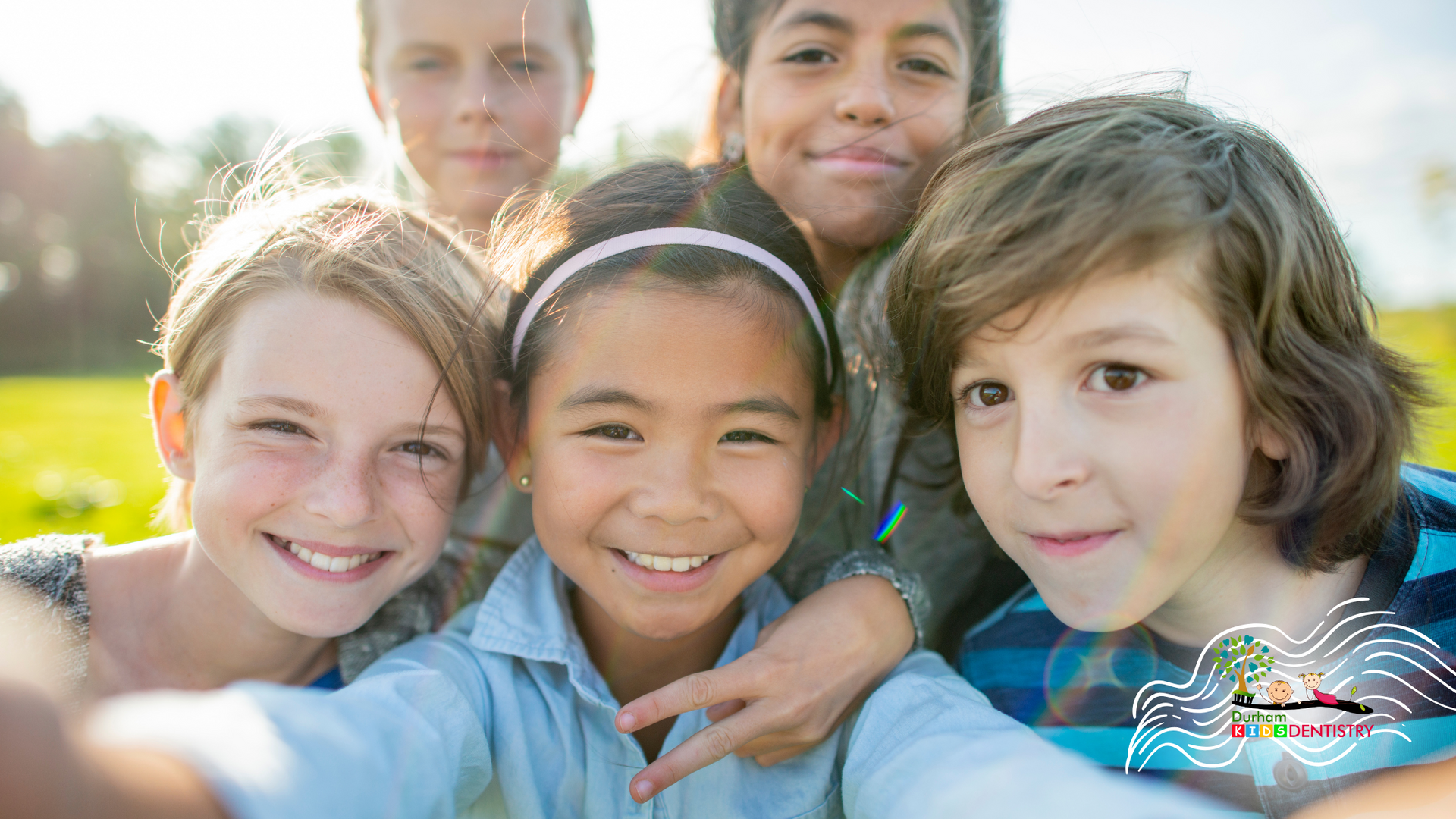 A group of children are posing for a picture together.