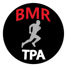 A circular black logo with red text