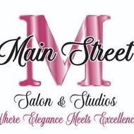 Logo for Main Street Salon & Studios featuring a large pink "M" with cursive text reading "Where Elegance Meets Excellence."