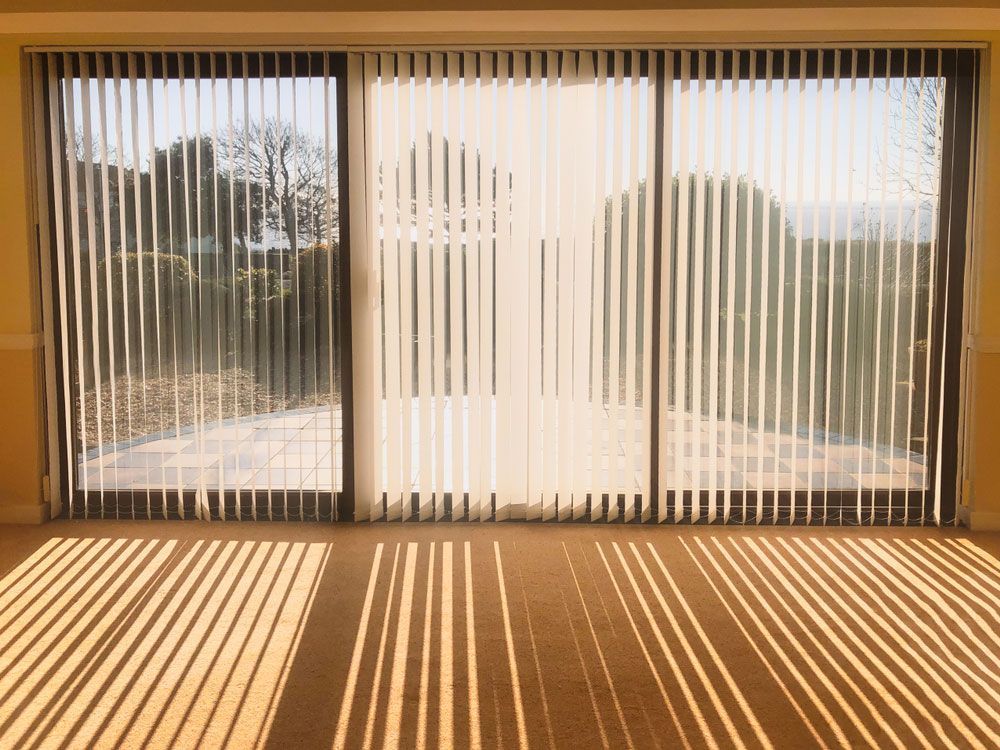Blinds Casting Shadows from Sunset — Window Furnishing Services in Casuarina, NSW