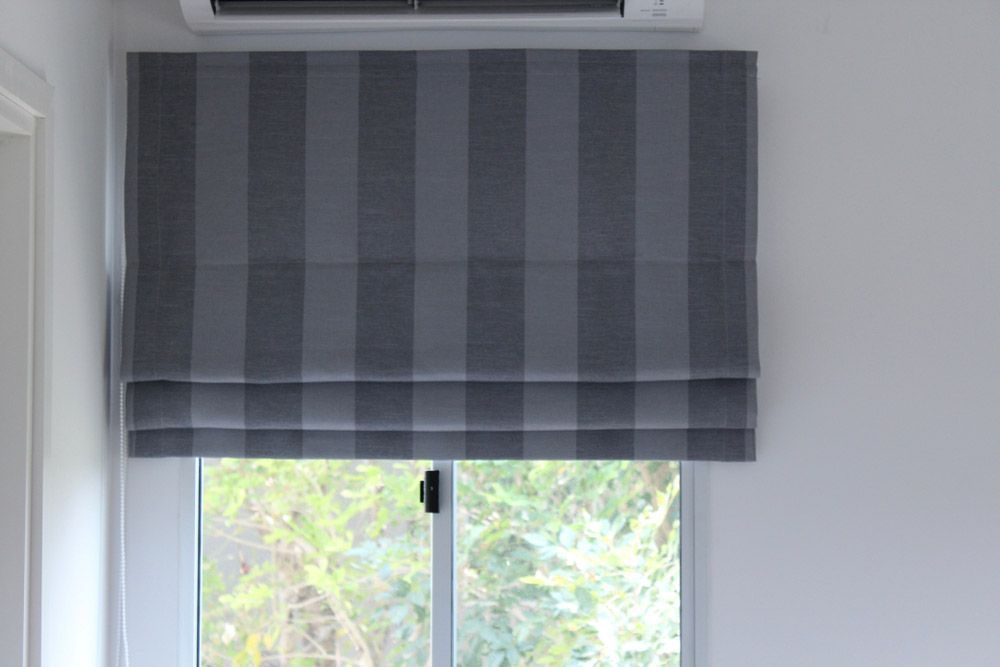Grey Roman Blind with Strip Pattern — Window Furnishing Services in Currumbin, NSW