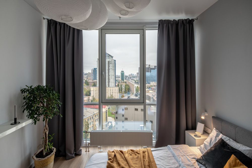 Modern Bedroom with Blackout Curtains — Window Furnishing Services in Byron Bay, NSW