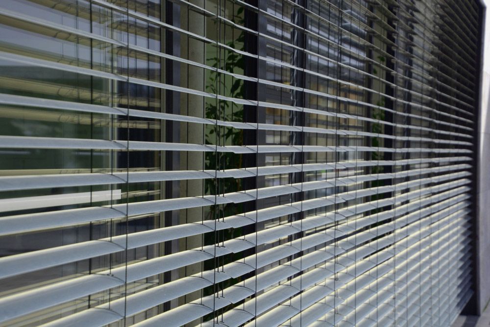 Office Window with Modern Exterior Shutter — Window Furnishing Services in Kingscliff, NSW