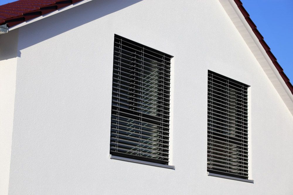 White louvers or Pull up blind — Window Furnishing Services in Tweed Heads, NSW