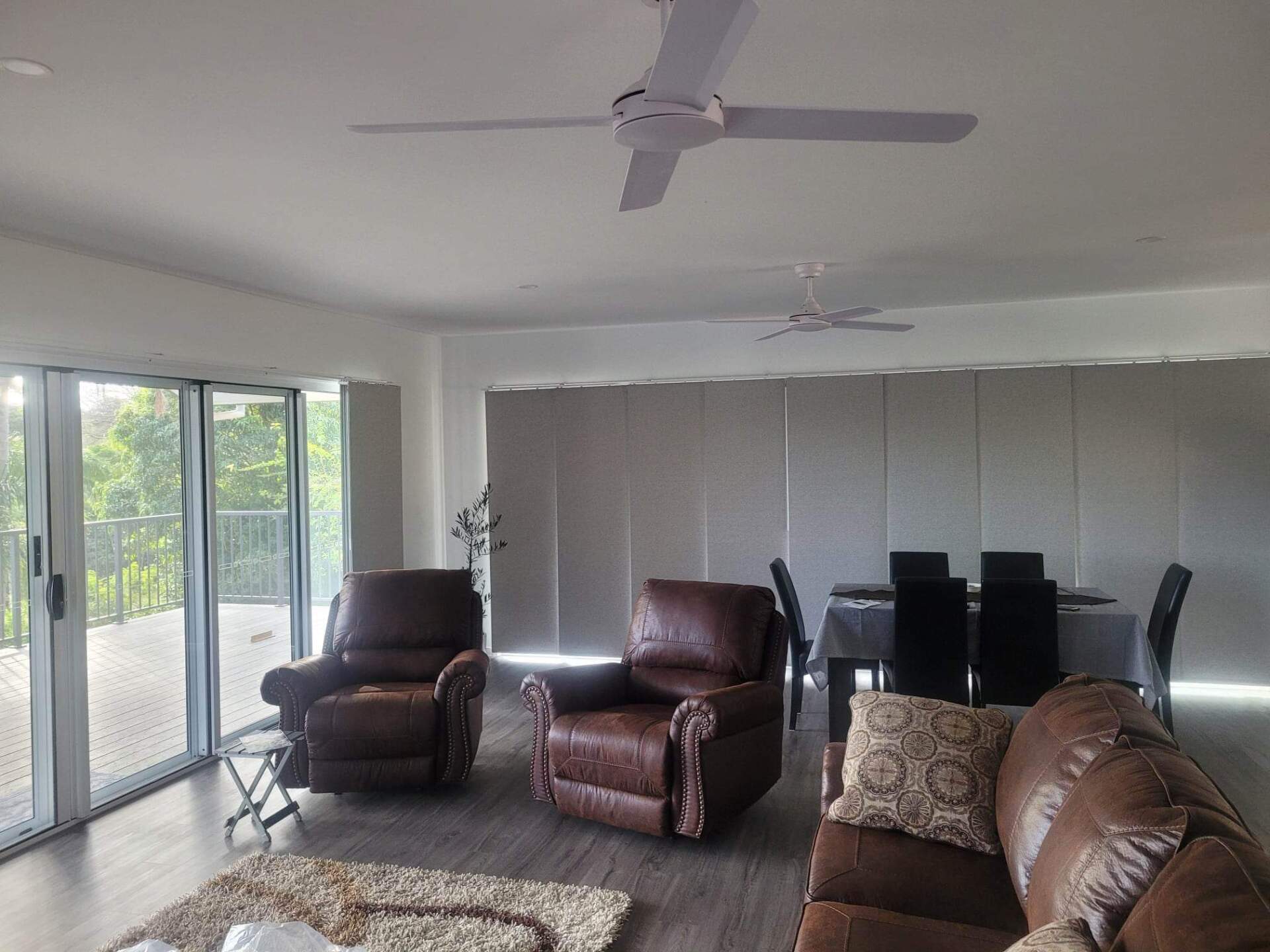 Man installing roller shutter on window — Blind Repairs in Tweed Heads, NSW