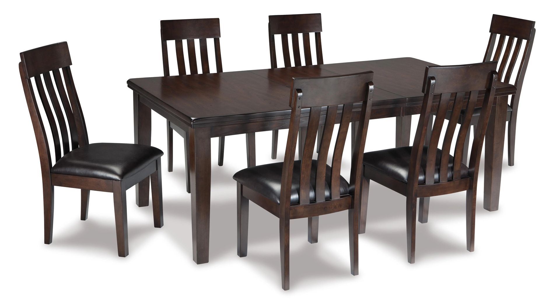 Dark wood dining table with six matching chairs on a white background