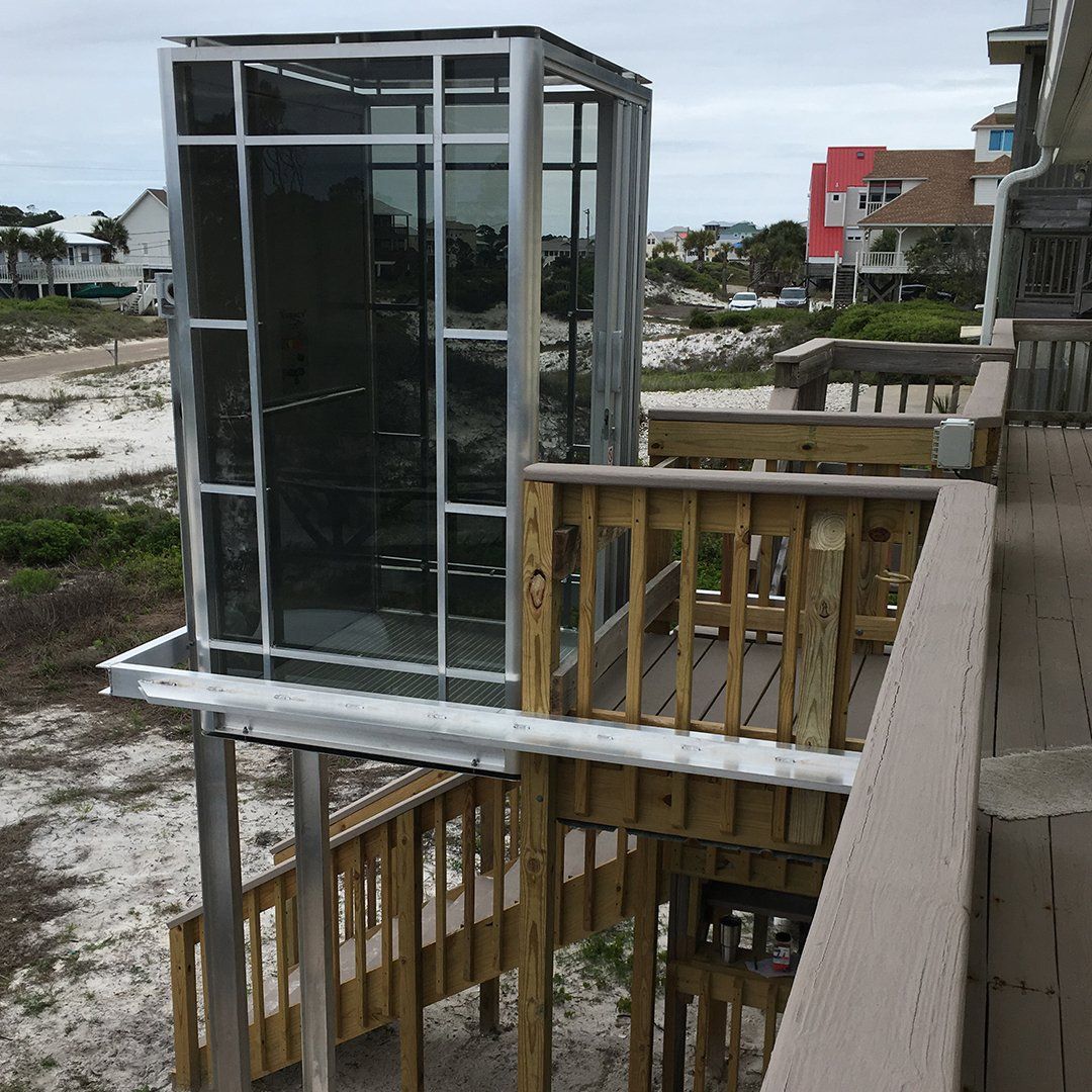 Passenger lift at the top of a large wooden deck