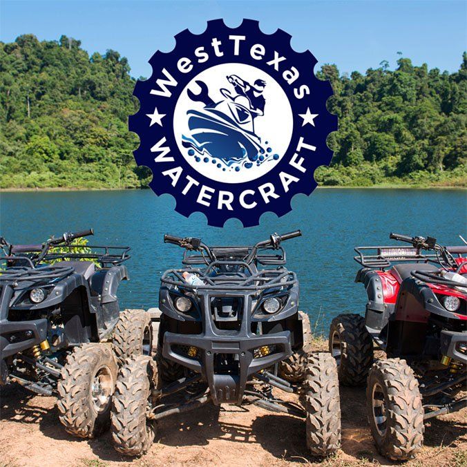 Four atvs are parked in front of a watercraft logo