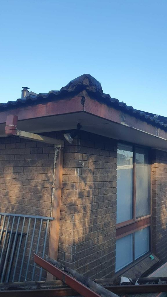 Brick Building Corner With Brown Roof — The Roofer Troopers in Howlong, NSW