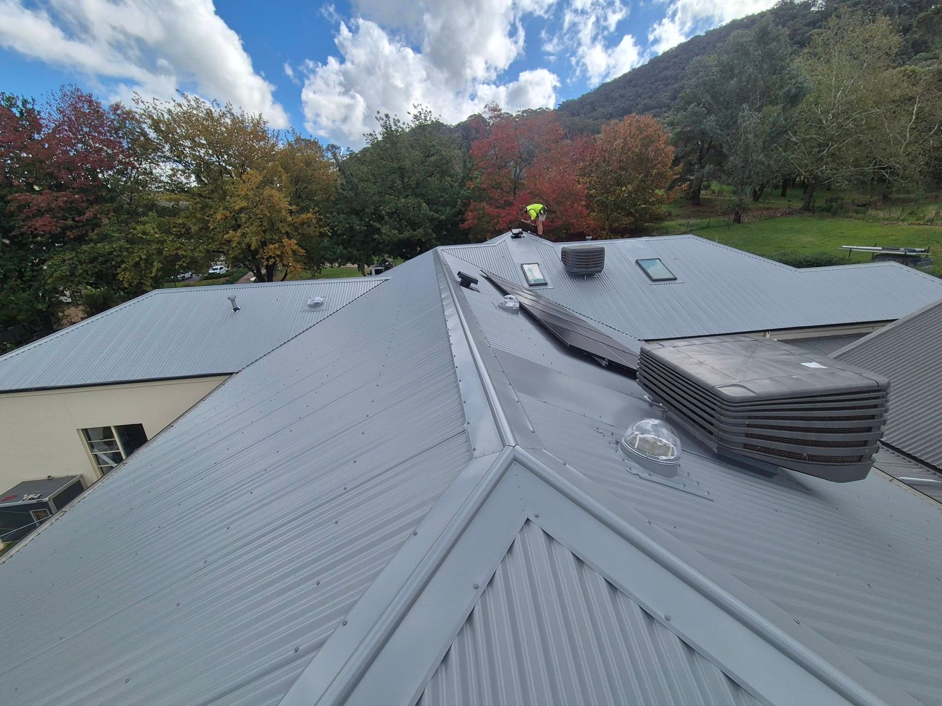 Roofing In Albury Project Showing Modern Metal Roof With Skylights, Solar Panels And Ridge Vents