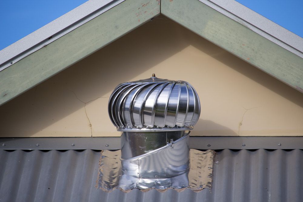 A Whirlybird on a Corrugated Metal Wall Beneath a Gable Roof — The Roofer Troopers in Howlong, NSW