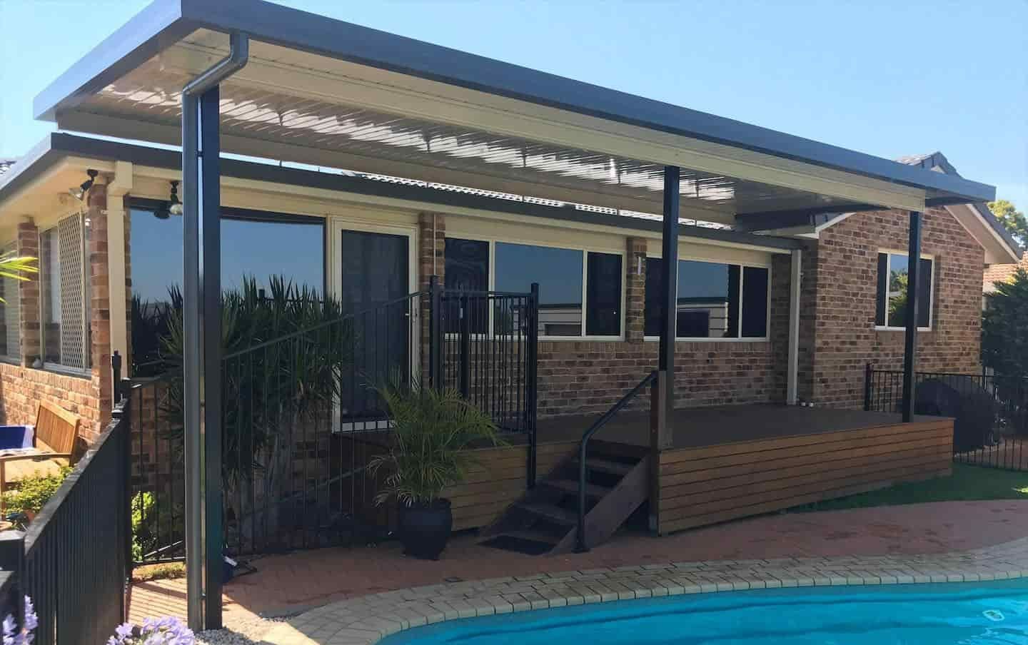 A House With A Covered Deck And Stairs Next To A Pool — Caprice Home Additions In Wingham, NSW