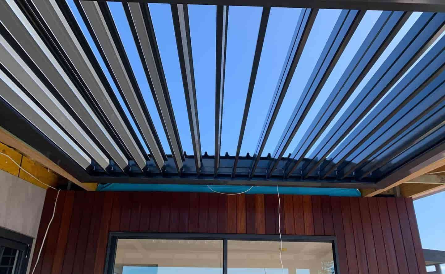 The Ceiling Of A House With A Pergola And Sliding Glass Doors — Caprice Home Additions In Taree, NSW