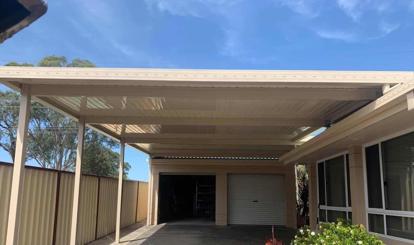 A Carport Is Attached To The Side Of A House — Caprice Home Additions In Port Macquarie, NSW