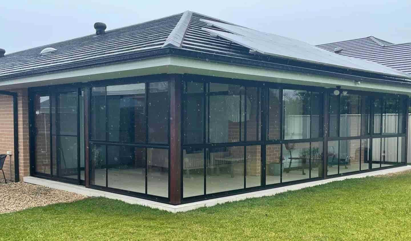 A House With A Screened In Porch And A Lot Of Windows — Caprice Home Additions In Port Macquarie, NSW