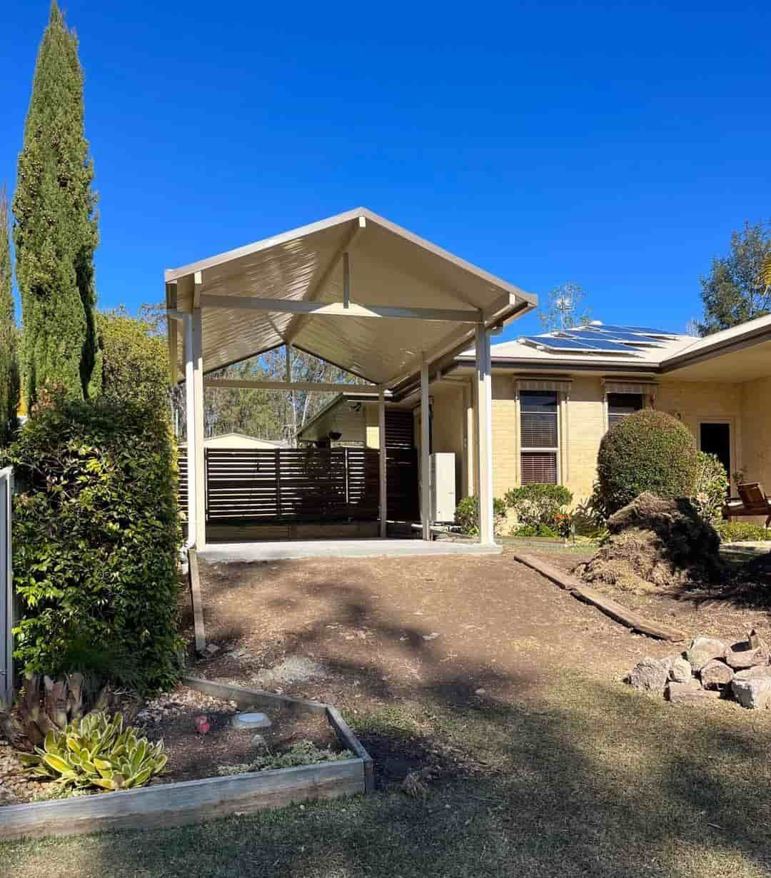 A House With A Carport In Front Of It — Caprice Home Additions In Forster, NSW