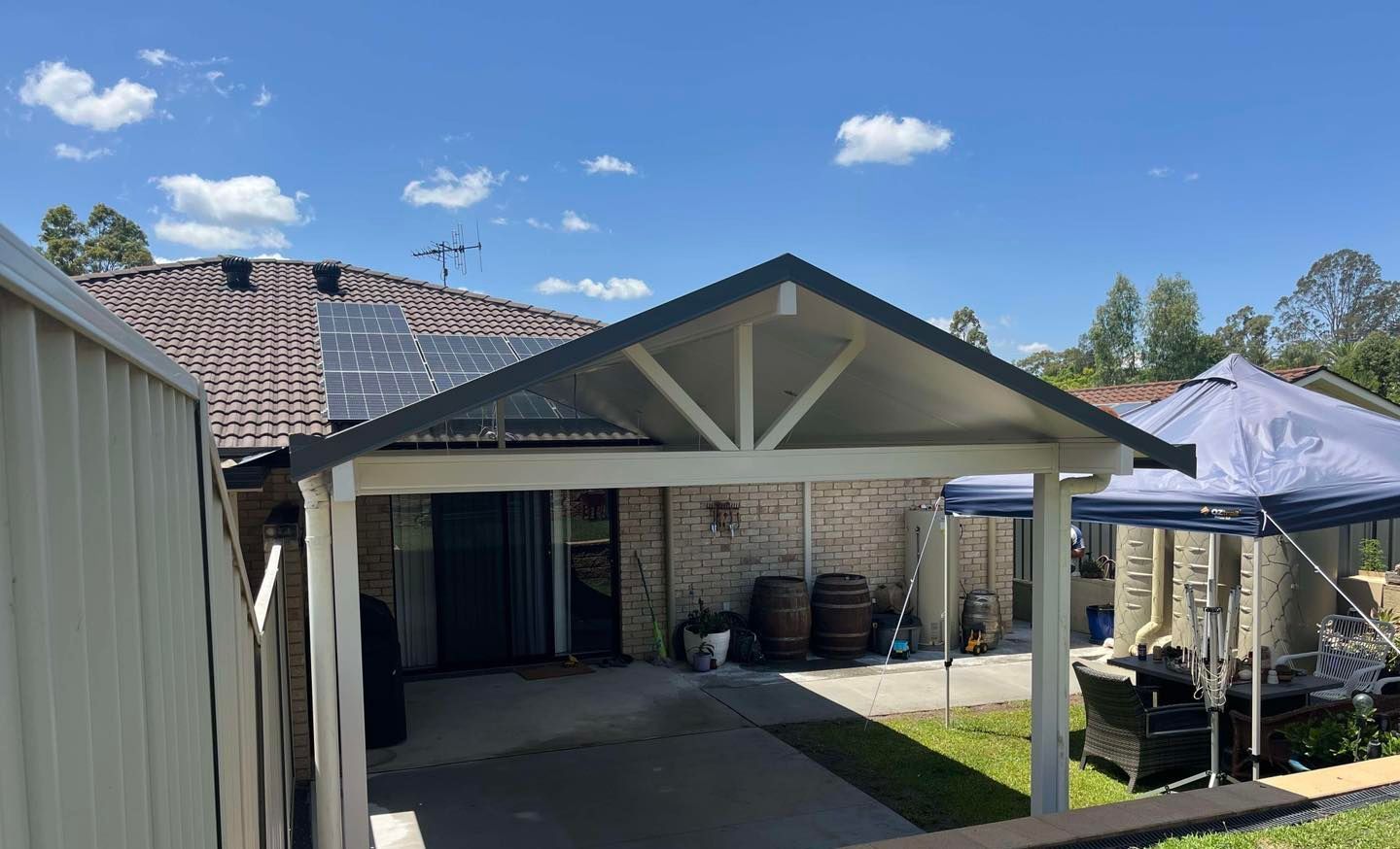 There is a carport in the backyard of a house. — Caprice Home Additions In Taree, NSW