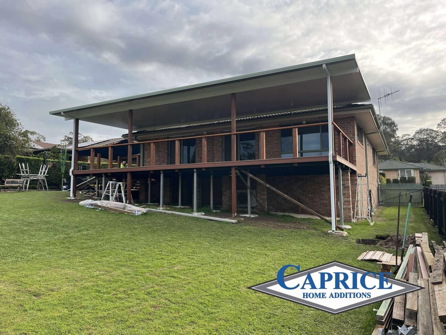 Brick House With Elevated Patio And Construction Materials