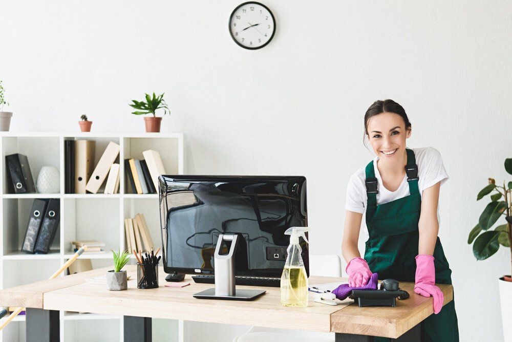 A cleaner sweeping the office during office cleaning service  in Maidenhead