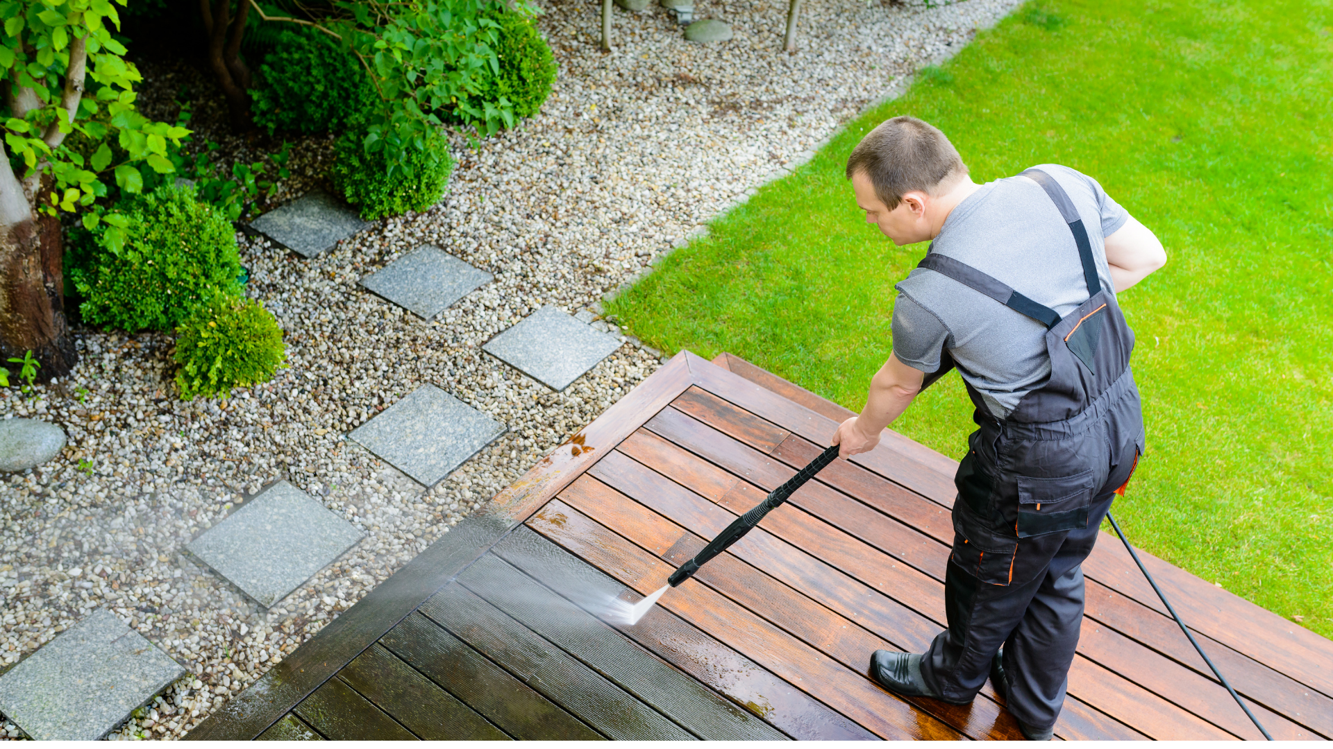 A cleaners during pressure washing of a client garden at Berkshire cleaning LTD