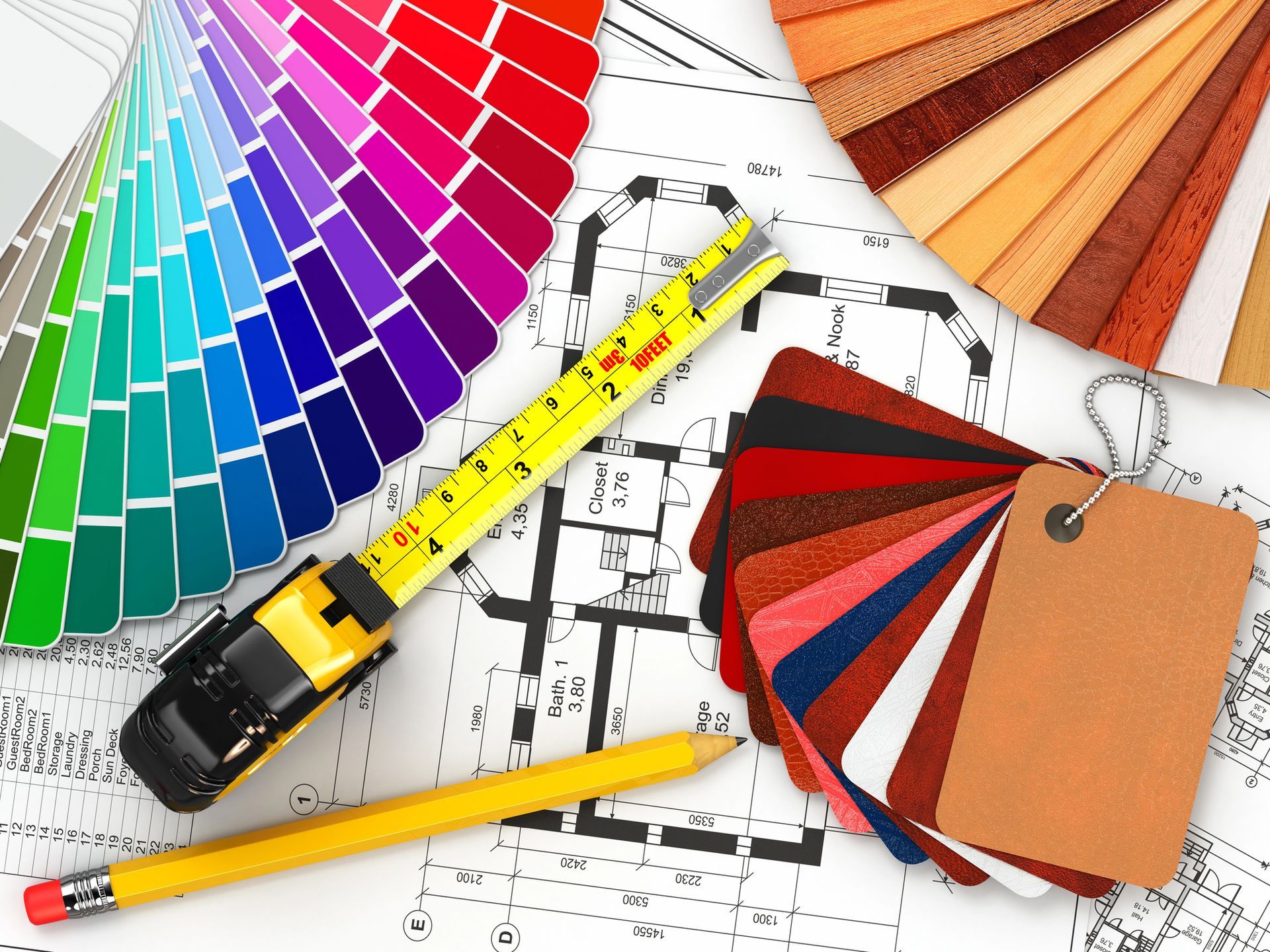 A measuring tape, pencil, color swatches, and fabric samples are laid out on top of architectural blueprints.