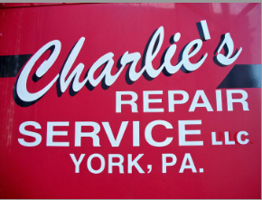 Charlie's Repair Service LLC sign in white on a red background, located in York, PA.