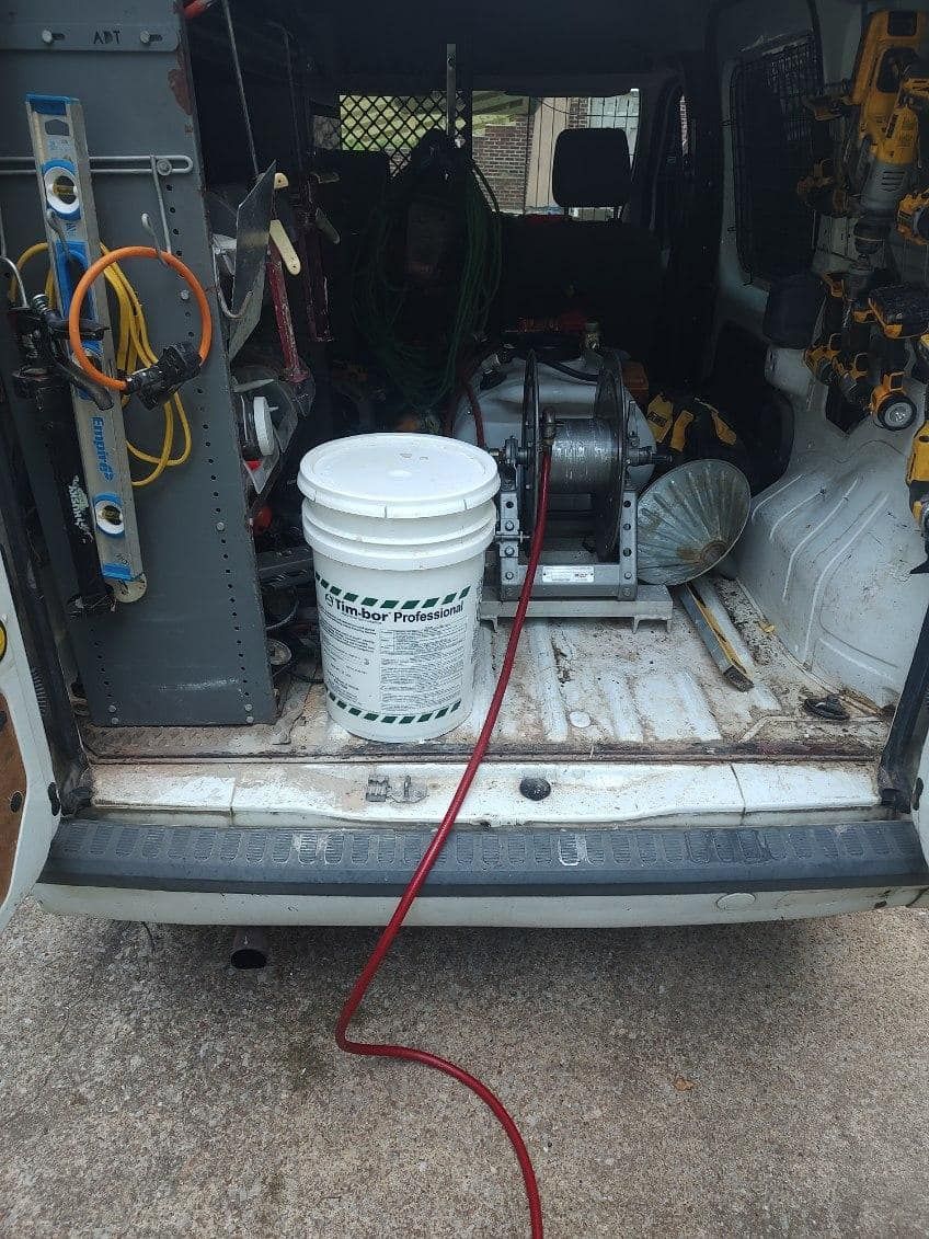 A white bucket is sitting in the back of a van.