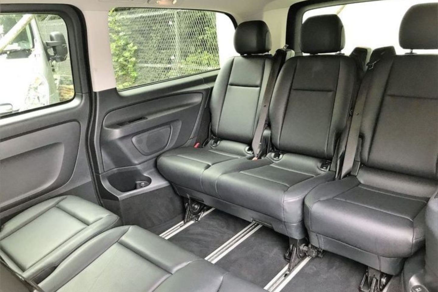 Comfortable leather seating inside an Athenaos Travel Mercedes van