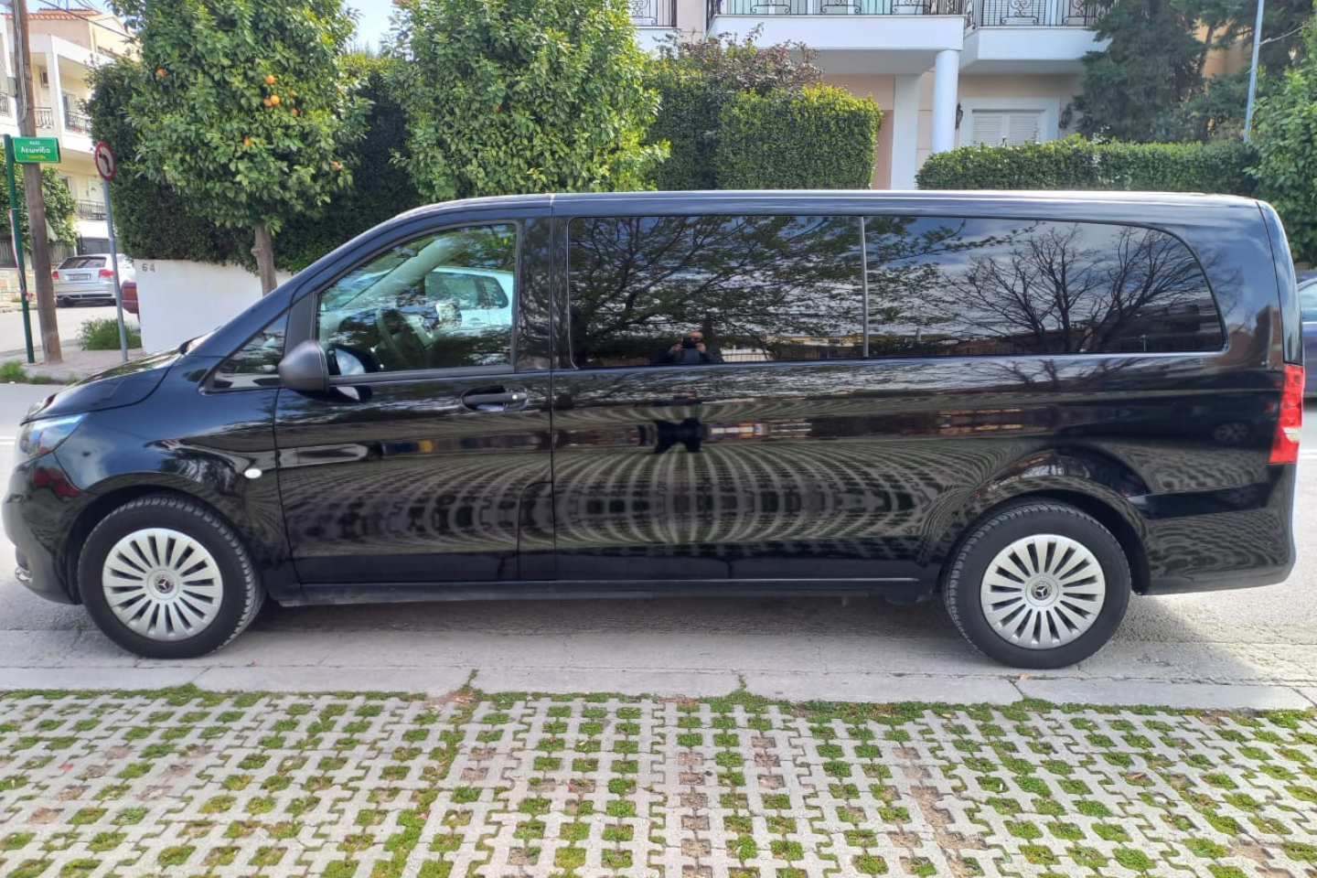 Side view of a luxury Mercedes van operated by Athenaos Travel & Tours