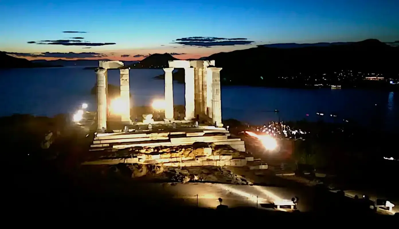International audiences view the Poseidon Templeβs lighting as it is broadcast live during a special event at Sounion Greece. Temple of Poseidon at Cape Sounion illuminated at night during the new lighting ceremony, overlooking the Aegean Sea.