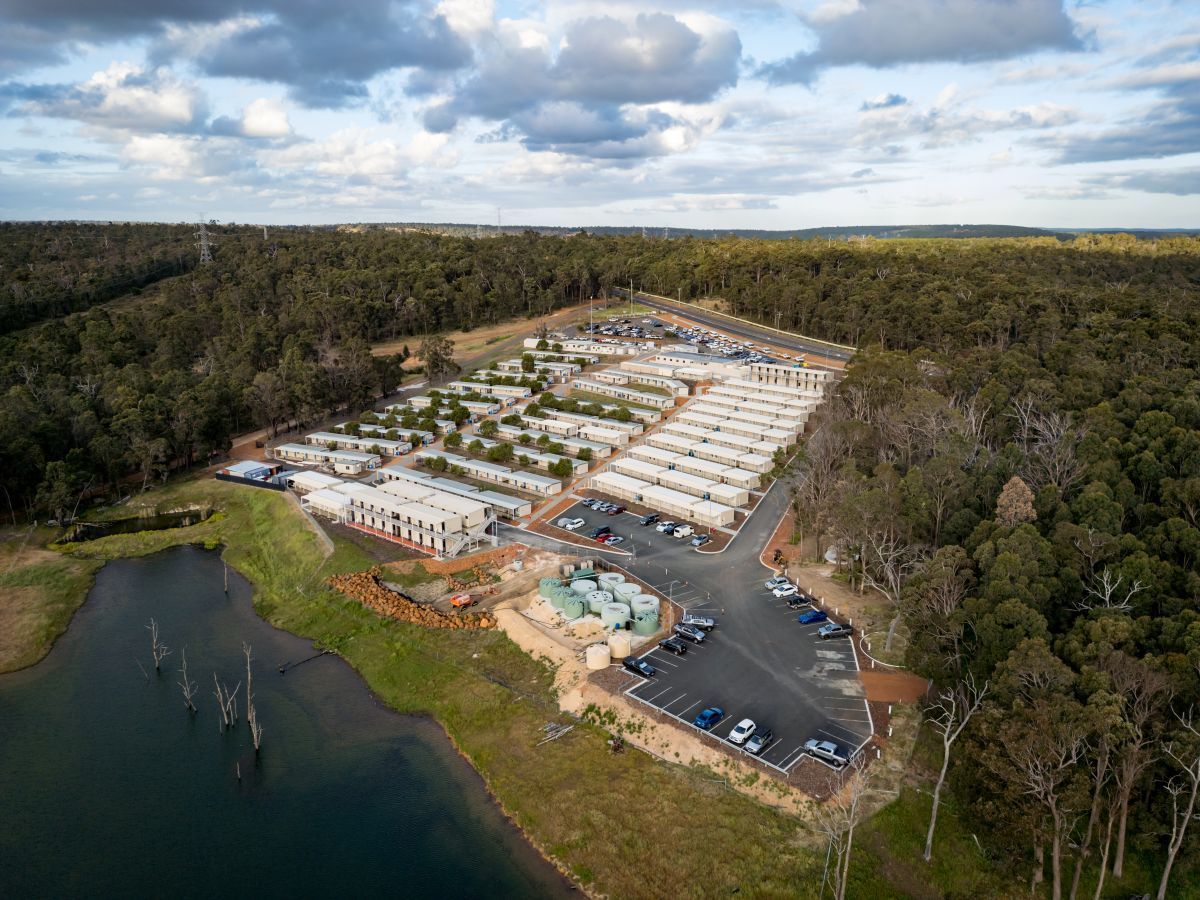Aerial view of Collie Hills Village surrounded by forest near Collie town