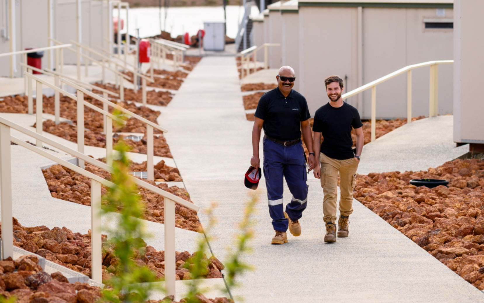 Two workers walking through Collie Hills Village accommodation